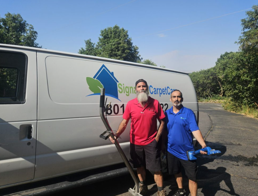 John Spears holding pet cleaning supplies